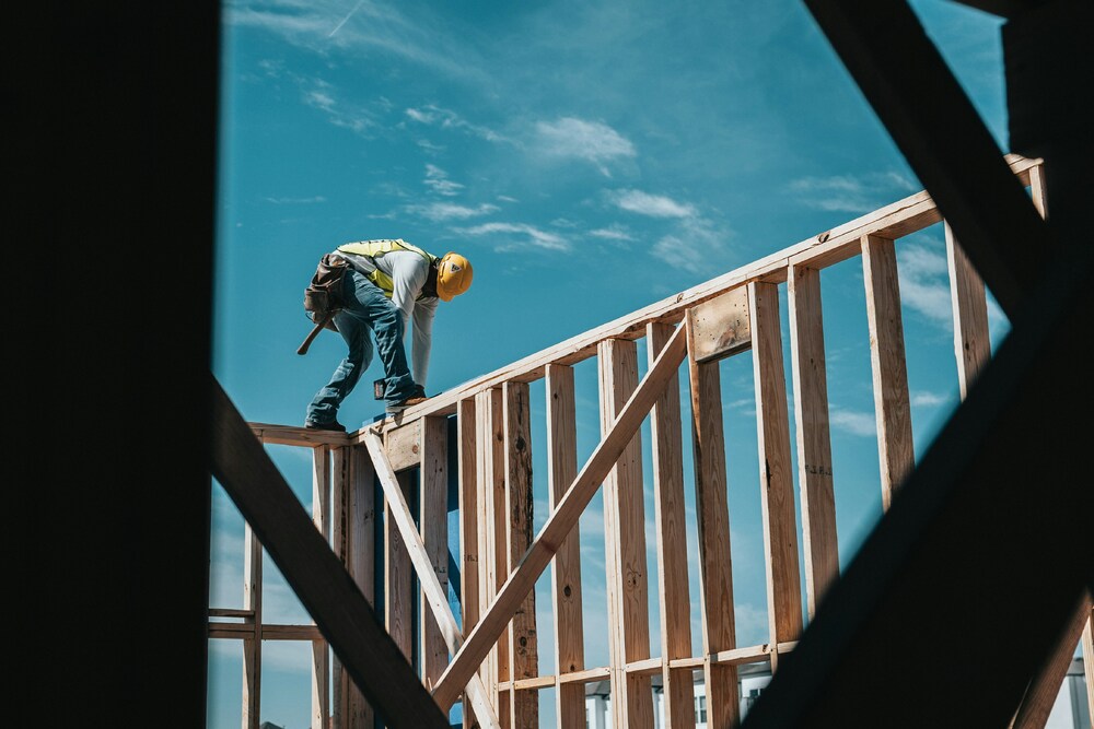 a construction worker performing hazardous work without safety equipment
