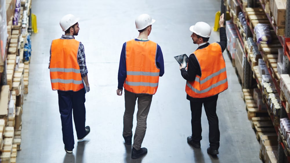 workers using ipad warehouse