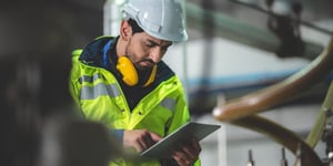 Equipment inspector using tablet for inspection