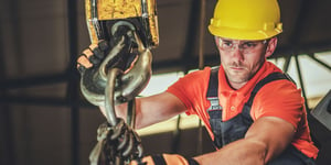 Warehouse inspector inspecting lifting equipment